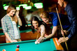 © BGStock72 - Young people playing pool