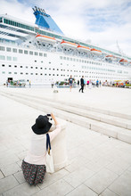 Passenger Photographing Big Cruise Ship