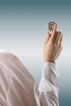 Female Doctor's Hand Holding Stethoscope On Blurred Background.