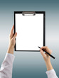 © Roman Motizov - A female hand holding a pen and clipboard with blank paper (docu