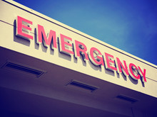 The Front Entrance Sign To An Emergency Room Department In A Cit