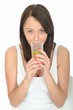 Healthy Young Woman Holding a Glass of Iced Water