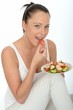 Healthy Young Woman Holding a Plate of Salmon Salad