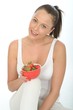 Healthy Young Woman Holding a Bowl of  Ripe Juicy Strawberries