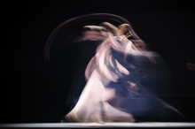 Blurry Dancers In Dynamic Dance. Dancers Dance On The Dark Stage. Slow Shutter Speed Photography. .