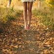 © VectorART - Beautiful female legs in the autumn road