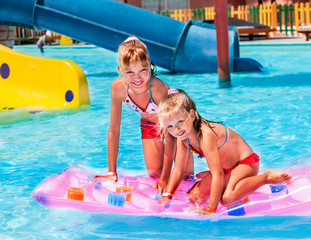 Wall Mural - Child on water slide at aquapark.