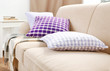 © Africa Studio - Interior design with pillows on sofa, closeup