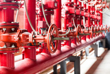A Row Of Red Color Fire Fighting Water Supply Pipeline System