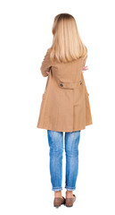 Wall Mural - back view of standing young beautiful  blonde woman in brown clo