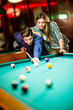 © BGStock72 - Young couple playing pool