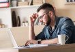 © Zoran Zeremski - Young business man working on laptop his office.