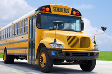 School Bus On Blacktop With Clean Sunny Background