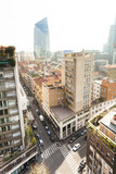 Fototapeta Miasto - Milan streets, buildings and Diamond Tower seen from above