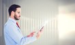 © WavebreakMediaMicro - Composite image of businessman scrolling on his digital tablet
