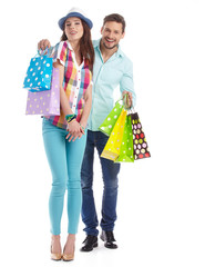 Sticker - Attractive young couple with shopping bags on white background