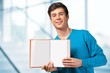 © BillionPhotos.com - Student. Attractive Young Man Holding Open Book with Blank Pages