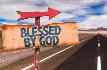Blessed By God sign with road background