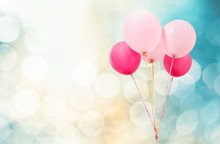 Abstract. Four Vintage Pink Balloons Over Turquoise Sky