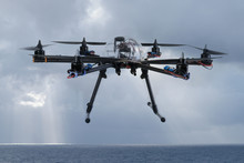 Hexacopter Drone Flying Over The Ocean