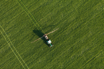 aerial view of harvest fields with tractor