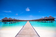 Water bungalows and wooden jetty on Maldives