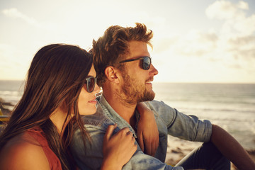 Wall Mural - Beautiful young couple enjoying the view