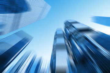 Wall Mural - low angle view of skyscrapers in blurred motion.