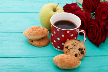 Wall Mural - Breakfast with cup of coffee and flowers. Selective focus