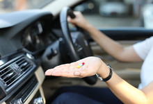 Women Taking Pills Inside His Car