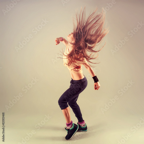 Studio shoot of active female funk jazz dancer moving. Plakát