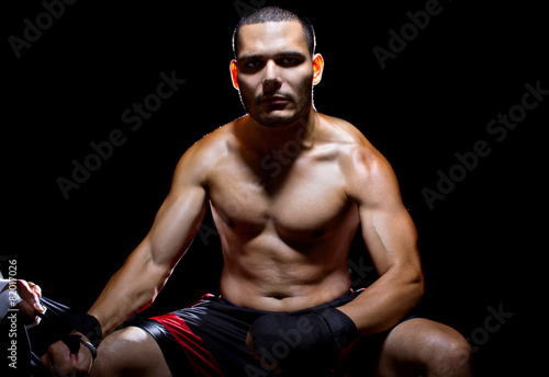 Foto Latin MMA fighter or Boxer with trainer applying athletic tape