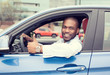 © pathdoc - Man happy smiling showing thumbs up driving sport blue car