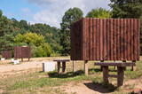Fototapeta Paryż - Wooden Dressing Cabins and Benches in Nature