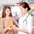 © DC Studio - Woman doctor and client inside pharmacy