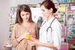 © DC Studio - Woman doctor and client inside pharmacy