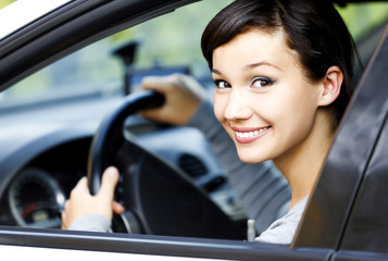 Wall Mural - Pretty girl in a car