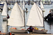 children learn to sail on optimist sailboat in Galicia Spain