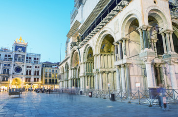 VENICE - APRIL 6, 2014: Tourists enjoy St Mark Square on a sprin