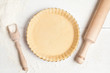 Tart pie preparation, dough with yeast and rolling pin on white
