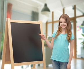 Sticker - happy little girl with blackboard and chalk