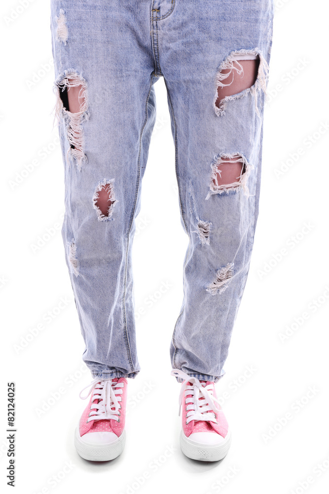 Person in torn jeans and pink sneakers isolated on white