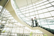 © Mike Kemp/Blend Images - Business people talking on office staircase