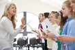© highwaystarz - Children In Singing Group Being Encouraged By Teacher