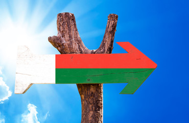 Madagascar Flag wooden sign with sky background