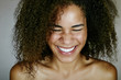 © Peathegee Inc/Blend Images - Nude mixed race woman smiling