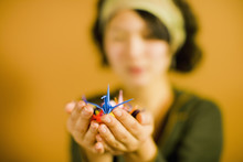 Japanese Woman Holding Origami Bird