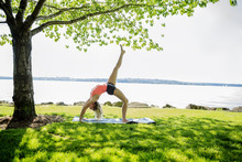 Caucasian Woman Practicing Yoga Outdoors