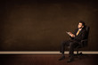 © ra2 studio - Businessman holding high tech tablet on background with copyspac