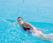 © mr.markin - Woman in goggles swimming front crawl style